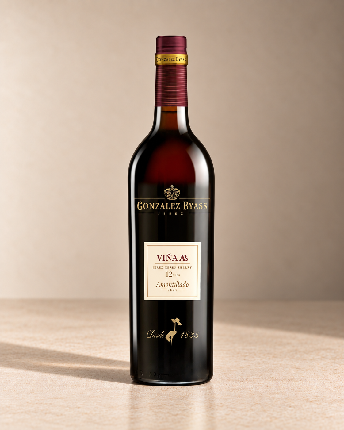 'Viña AB' Amontillado NV single wine bottle on a warm beige studio background