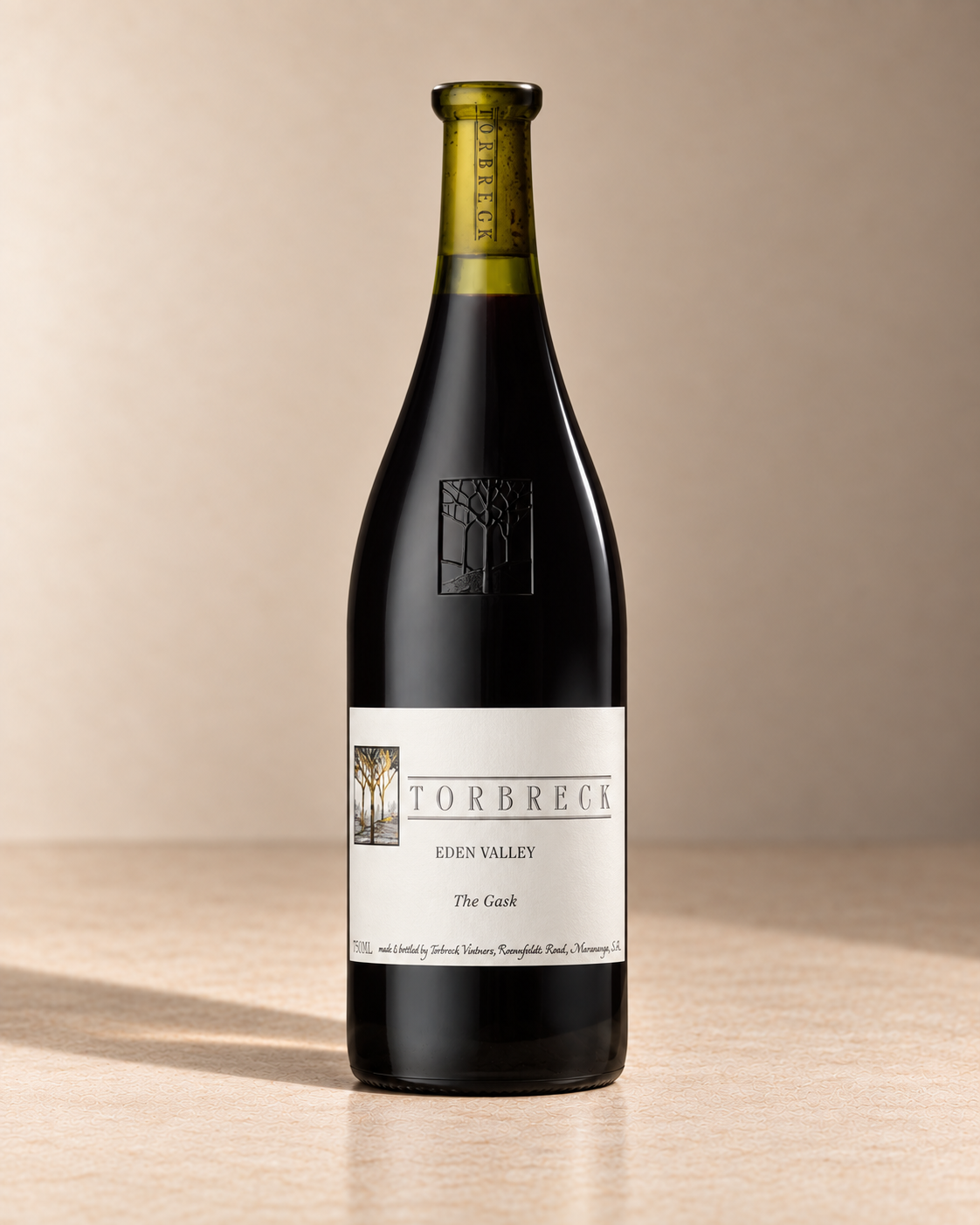 'The Gask' Shiraz 2021 single wine bottle on a warm beige studio background