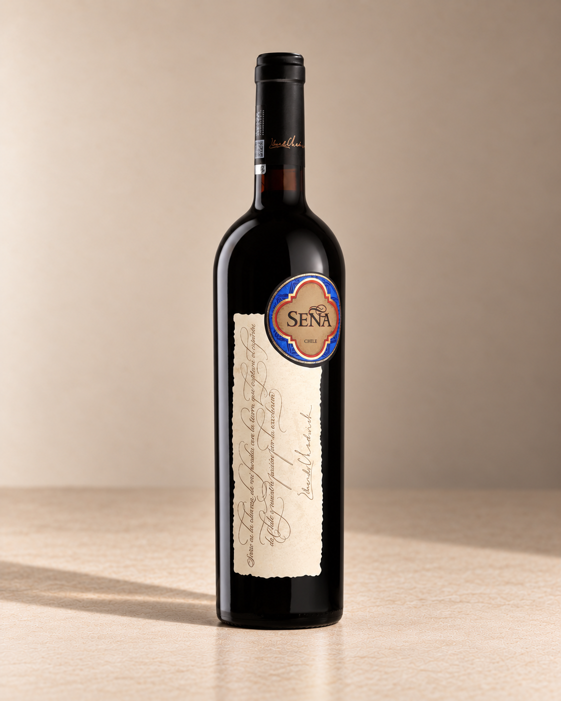 'Seña' Red Blend 2020 single wine bottle on a warm beige studio background