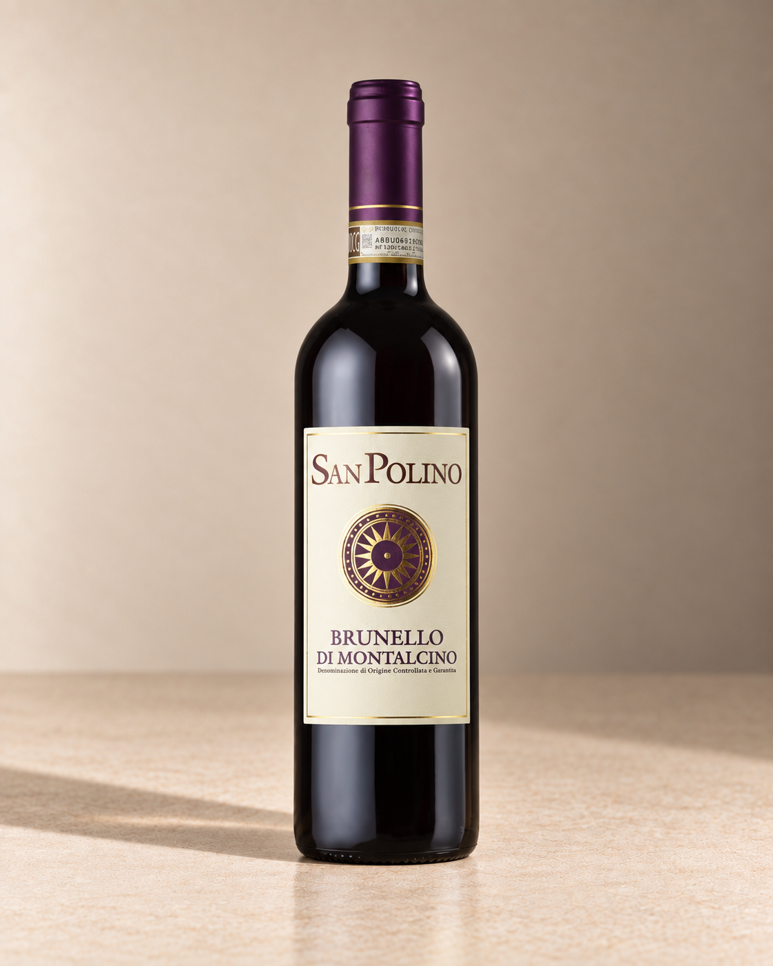 Brunello di Montalcino 2020 single wine bottle on a warm beige studio background