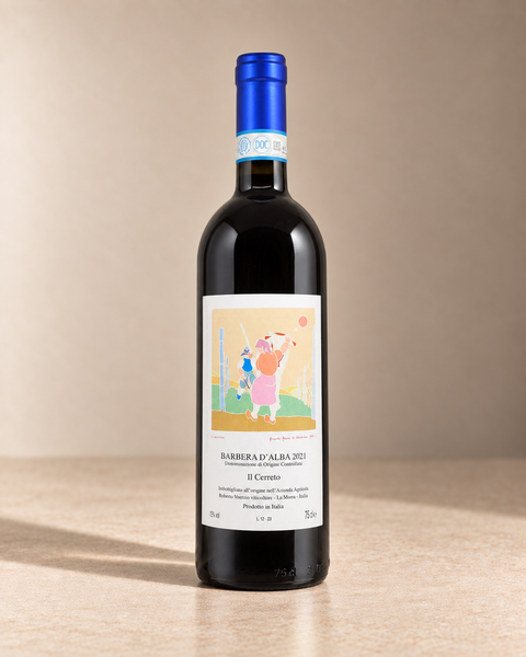'Il Cerreto' Barbera d'Alba 2021 single wine bottle on a warm beige studio background