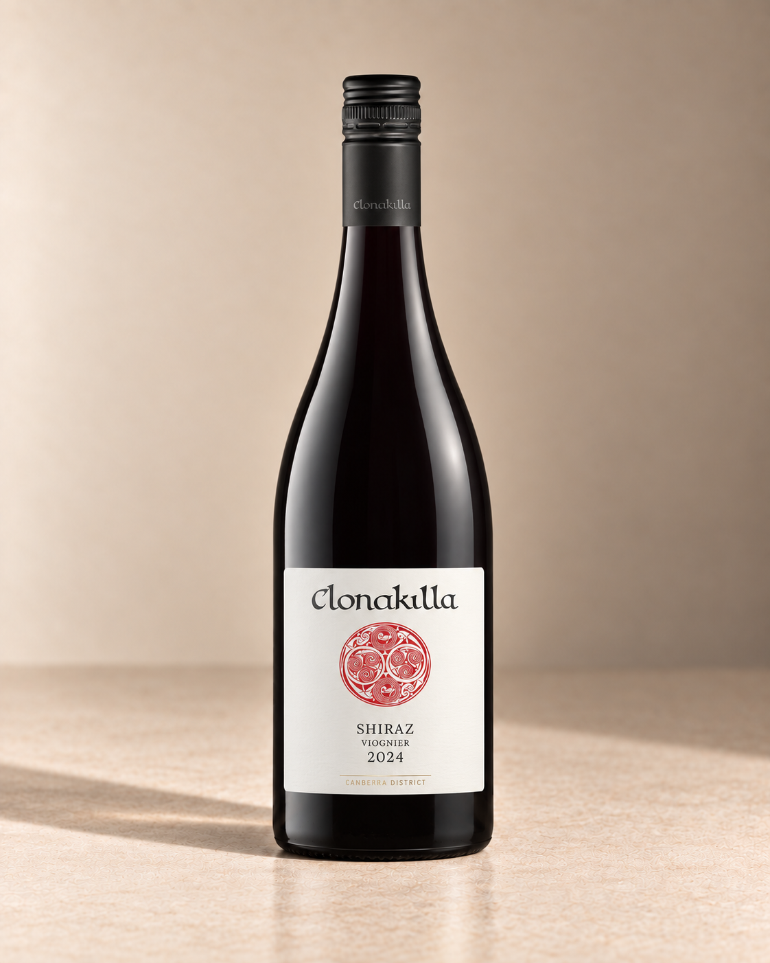 Shiraz-Viognier 2014 single wine bottle on a warm beige studio background