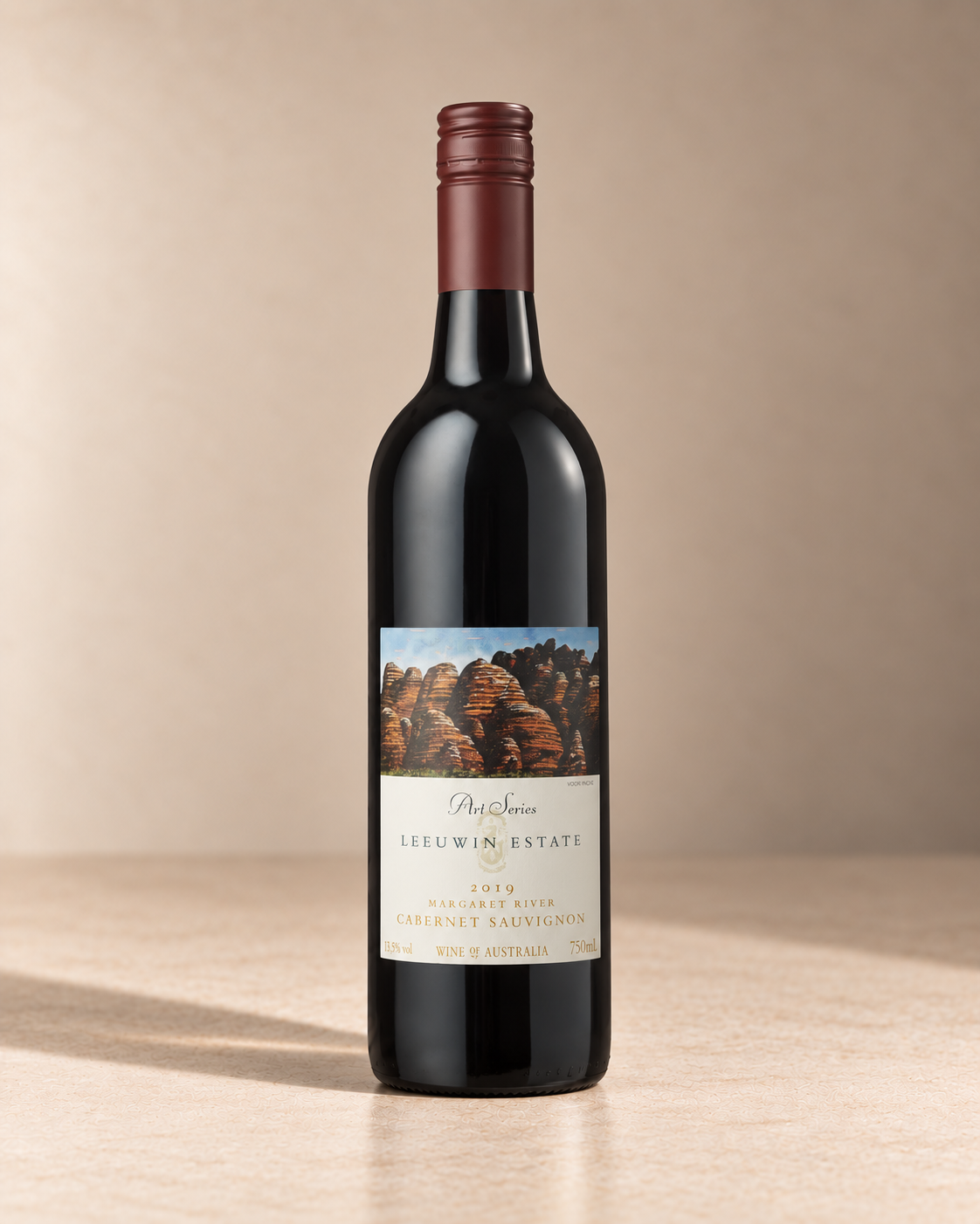 'Art Series' Cabernet Sauvignon 2019 single wine bottle on a warm beige studio background