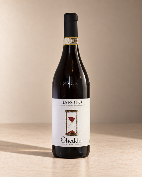 Barolo 2021 single wine bottle on a warm beige studio background