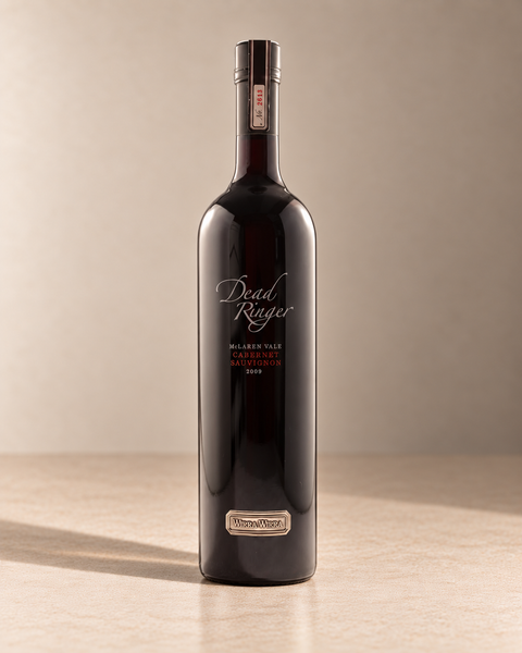 'Dead Ringer' Cabernet Sauvignon 2015 single wine bottle on a warm beige studio background