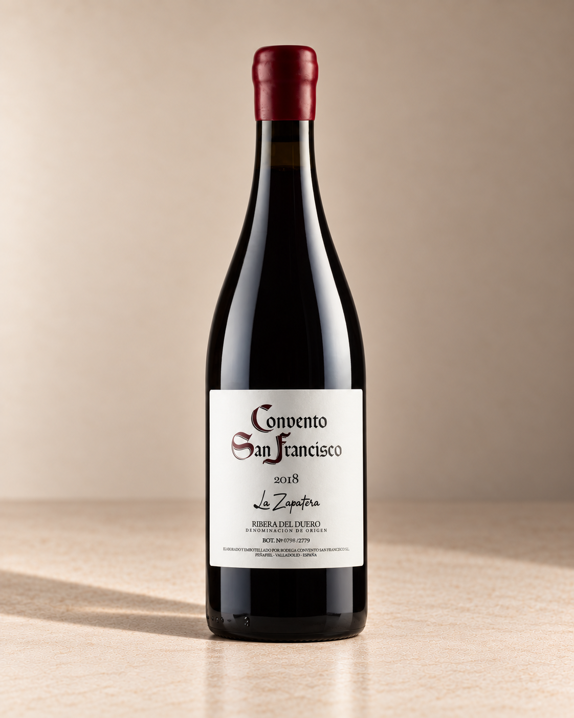 'La Zapatera' Tempranillo 2018 single wine bottle on a warm beige studio background