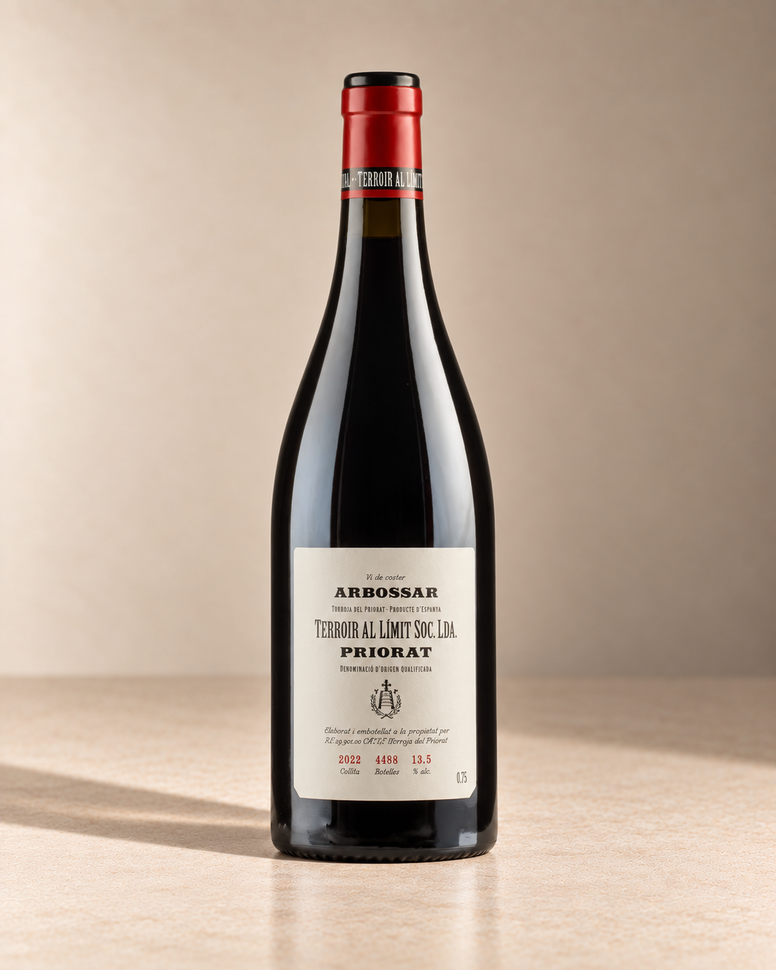 'Arbossar' Priorat 2022 single wine bottle on a warm beige studio background