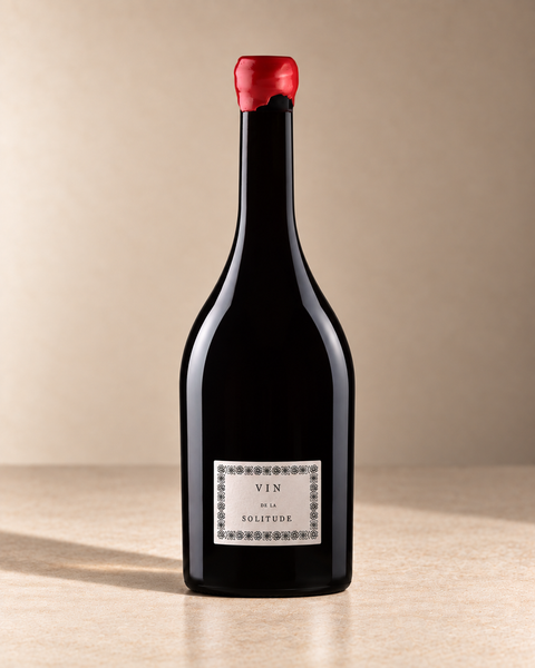 'Vin de la Solitude' Châteauneuf du Pape 2023 single wine bottle on a warm beige studio background