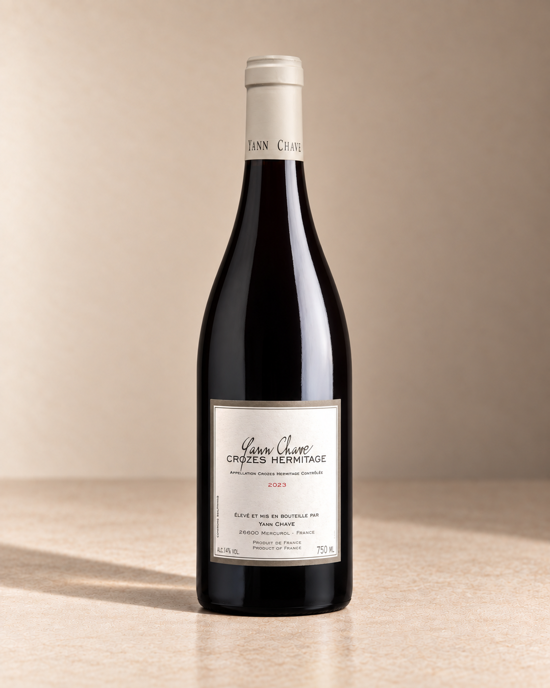 Crozes-Hermitage 2023 single wine bottle on a warm beige studio background