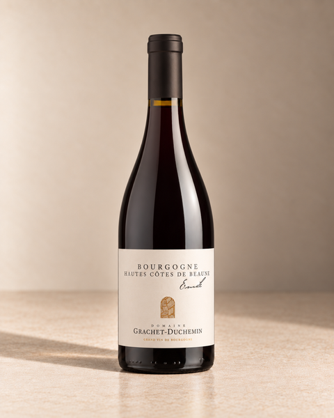 'Emile' Hautes-Côtes de Beaune 2023 single wine bottle on a warm beige studio background