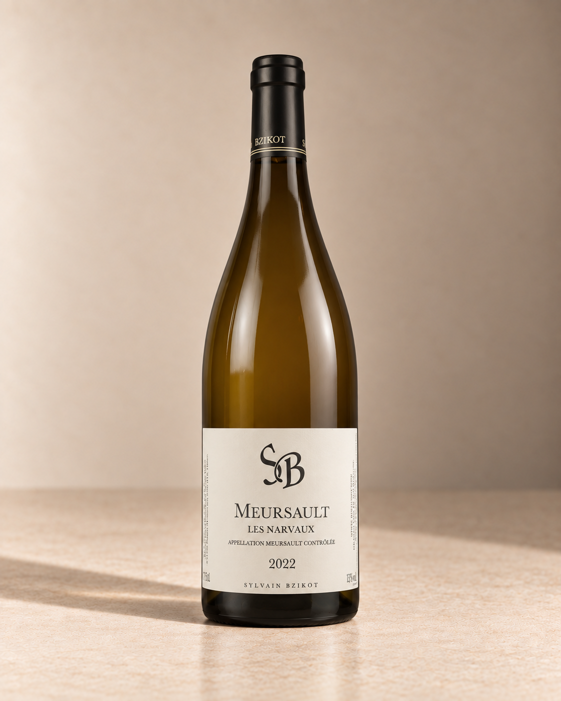 'Narvaux' Meursault 2022 single wine bottle on a warm beige studio background