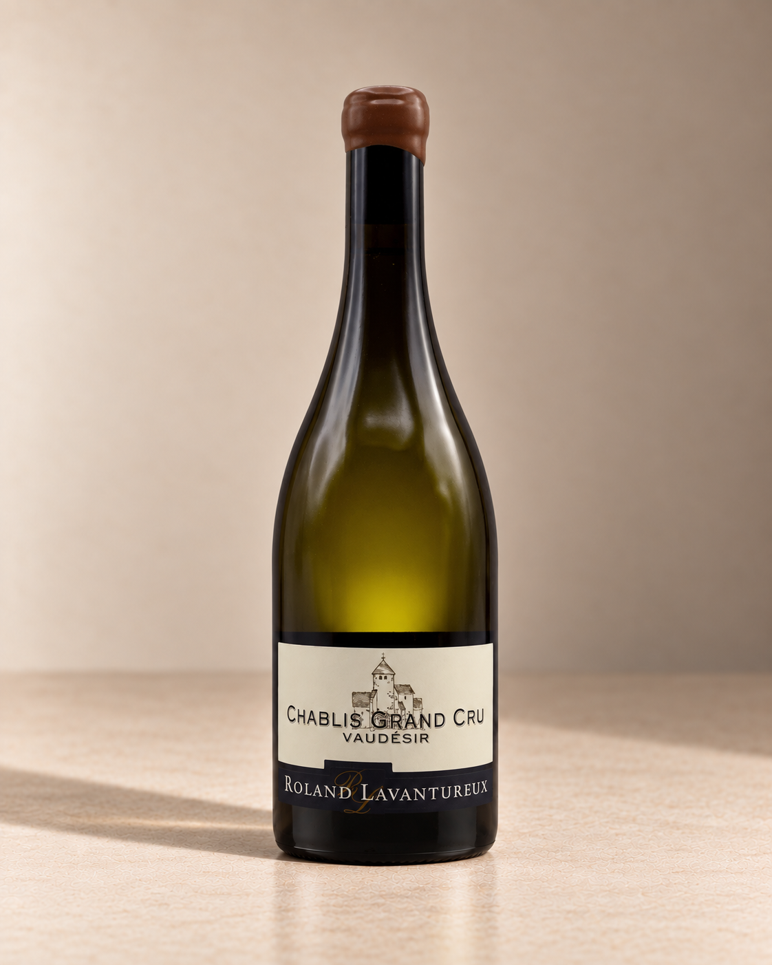 'Vaudesir' Chablis Grand Cru  2018 single wine bottle on a warm beige studio background