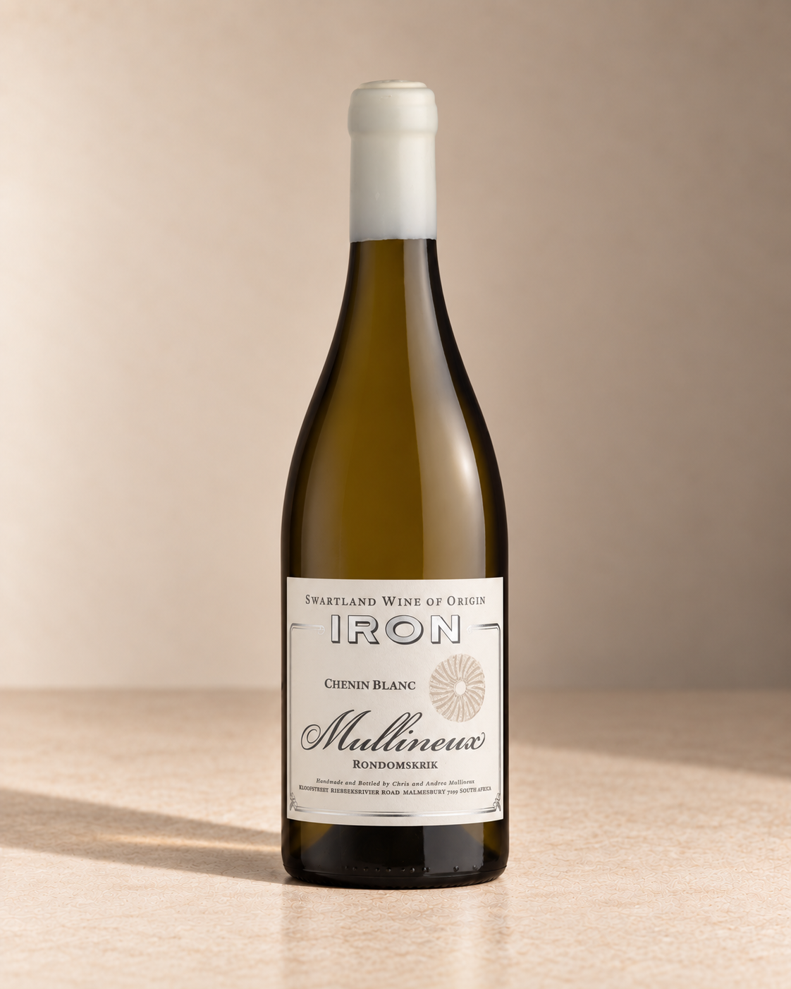 'Iron' Chenin Blanc 2023 single wine bottle on a warm beige studio background