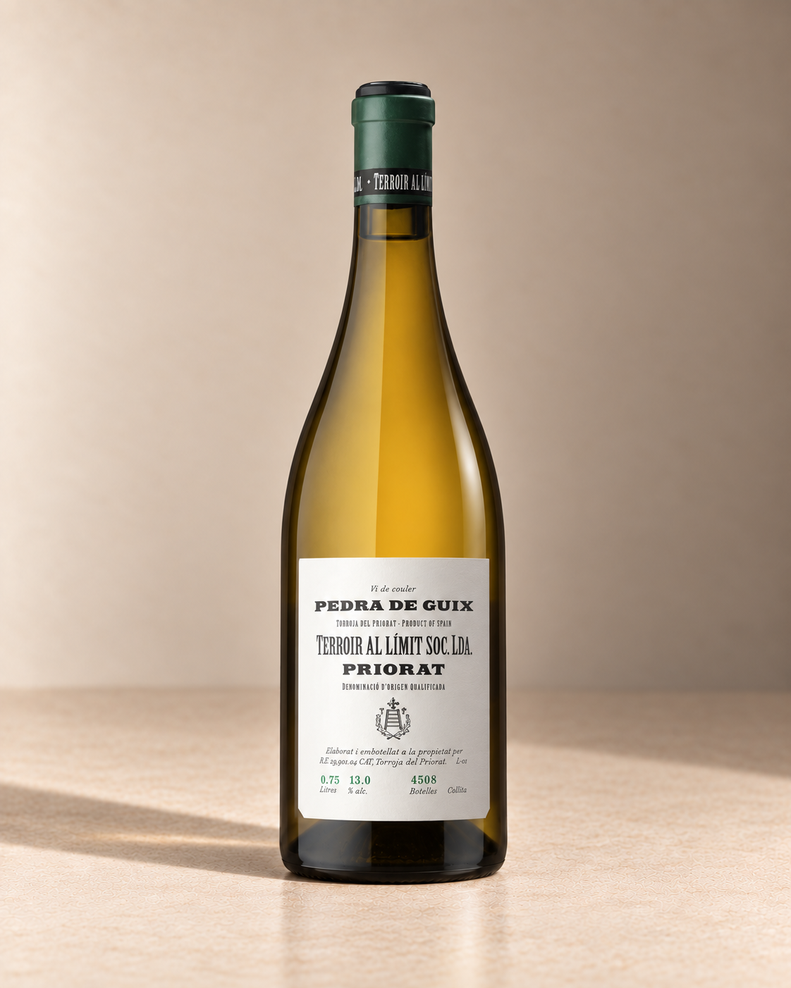 'Pedra de Guix' White Blend 2022 single wine bottle on a warm beige studio background