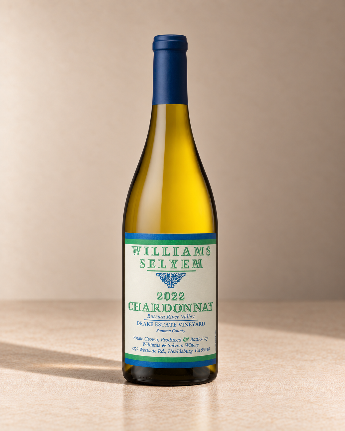 'Drake Estate Vineyard' Chardonnay 2022 single wine bottle on a warm beige studio background