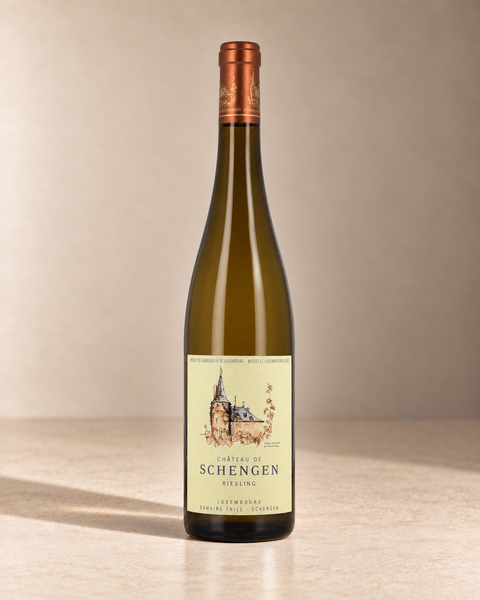 Château de Schengen Riesling 2023 single wine bottle on a warm beige studio background