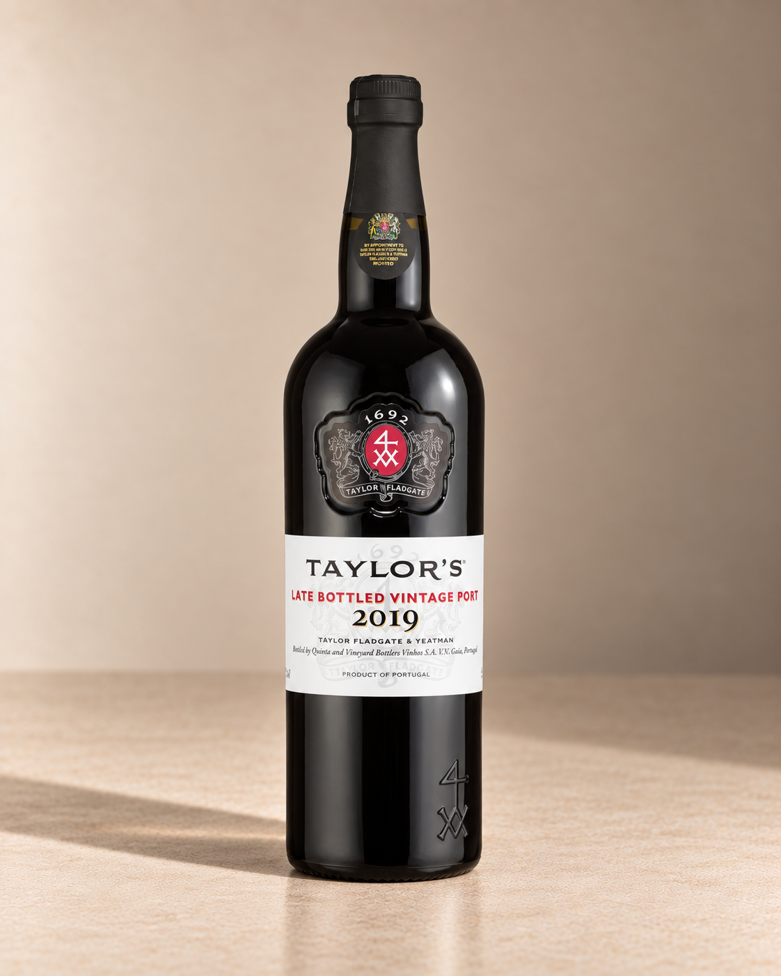LBV Port 2019 single wine bottle on a warm beige studio background