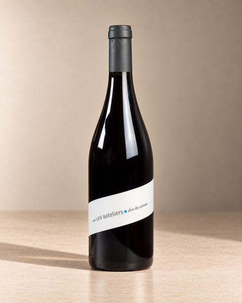 'Les Bateliers' Côtes du Rhône Rouge 2023 single wine bottle on a warm beige studio background