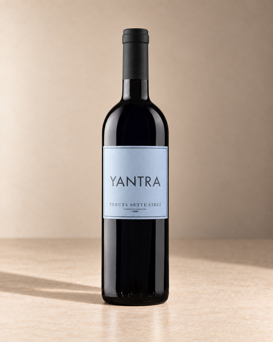 Tenuta Sette Cieli 'Yantra' Toscana IGT 2022 (100ml) single wine bottle on a warm beige studio background